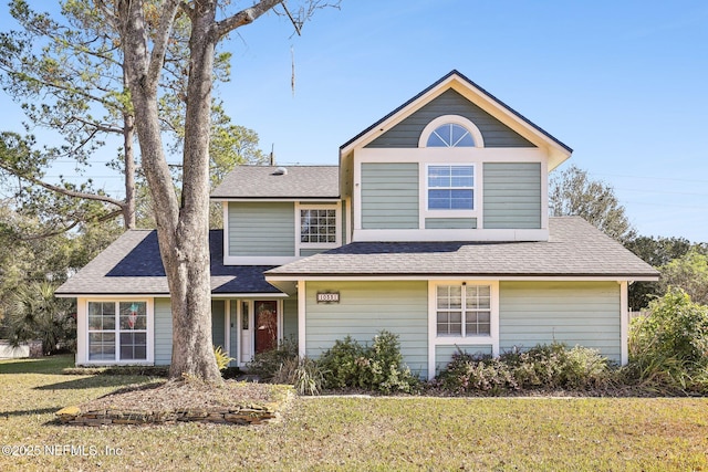 front facade with a front yard