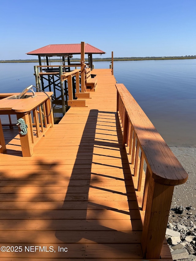 view of dock with a water view