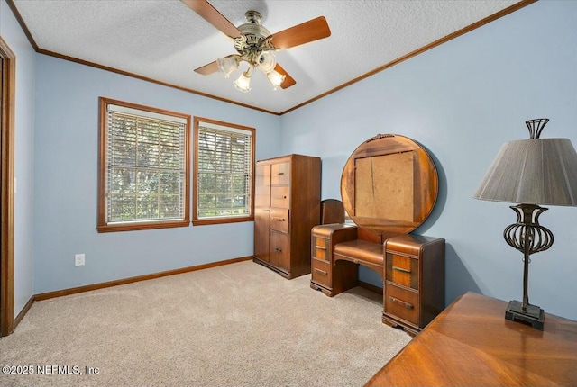 carpeted bedroom featuring a textured ceiling, ornamental molding, and ceiling fan