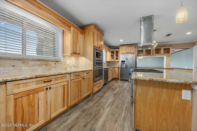 kitchen with tasteful backsplash, decorative light fixtures, a kitchen island, island exhaust hood, and stainless steel appliances