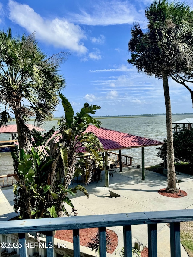 exterior space featuring a gazebo and a water view