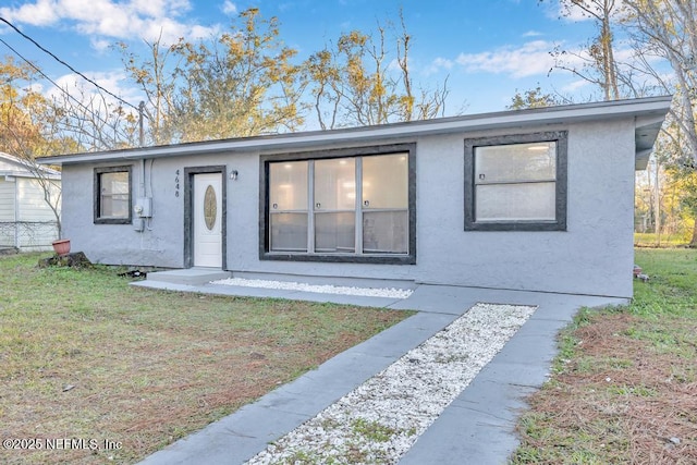 view of front of home with a front lawn