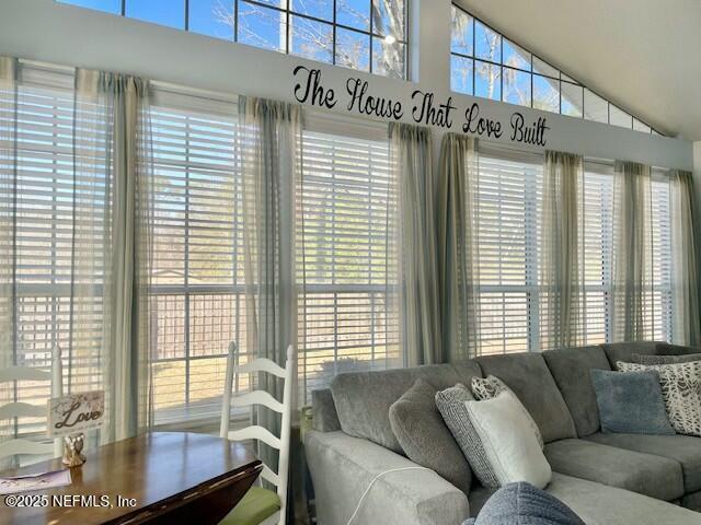 living room featuring vaulted ceiling