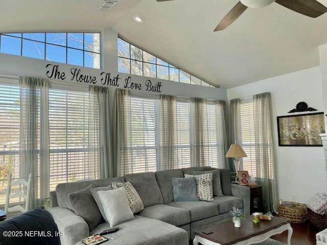 living room with vaulted ceiling and ceiling fan