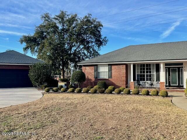 view of side of property with a garage and a yard