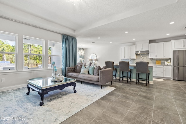 living room with a textured ceiling