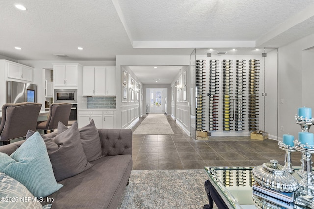 living room with a textured ceiling