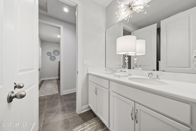 bathroom with tile patterned floors and vanity