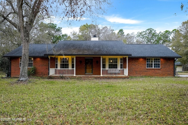 single story home featuring a front lawn and a porch