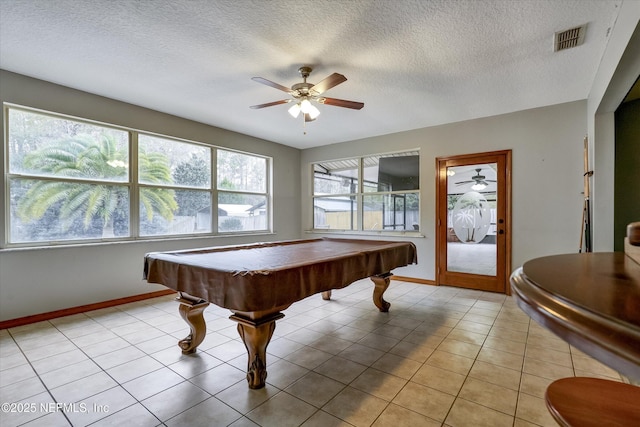 recreation room with billiards, light tile patterned flooring, and a textured ceiling