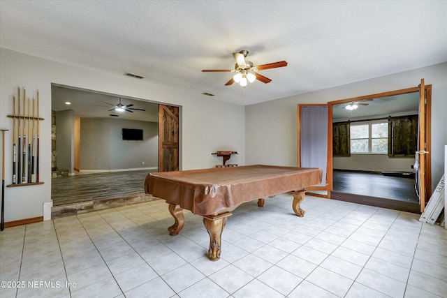 rec room featuring ceiling fan, a textured ceiling, billiards, and light tile patterned flooring