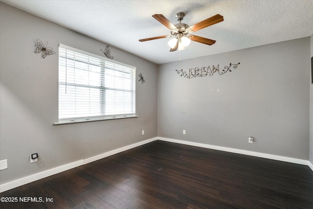 unfurnished room with ceiling fan, a textured ceiling, and dark hardwood / wood-style floors