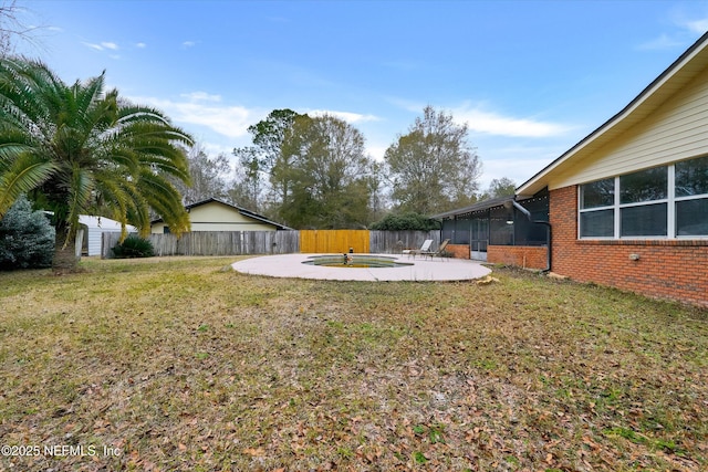 view of yard featuring a patio and a sunroom