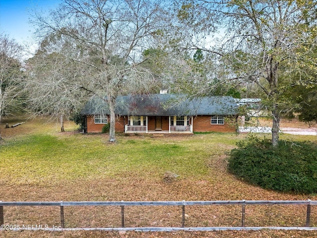 view of front of property with a front lawn and covered porch