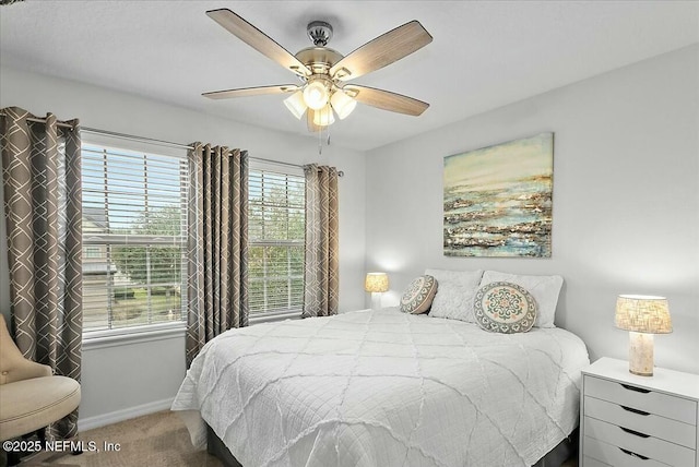 bedroom with ceiling fan and carpet flooring