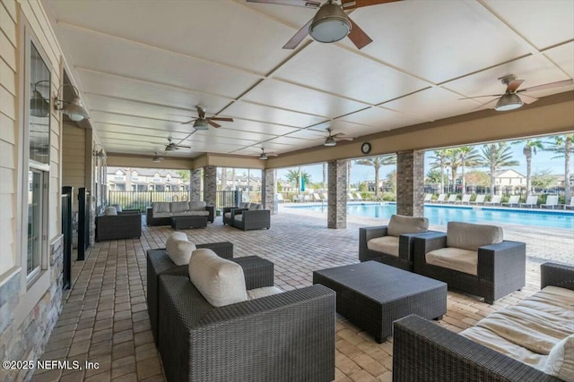 view of patio with an outdoor hangout area and a community pool