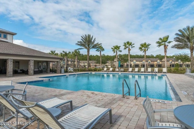 view of swimming pool with a patio