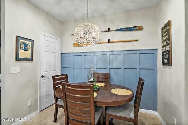 dining room featuring a chandelier and light tile patterned flooring