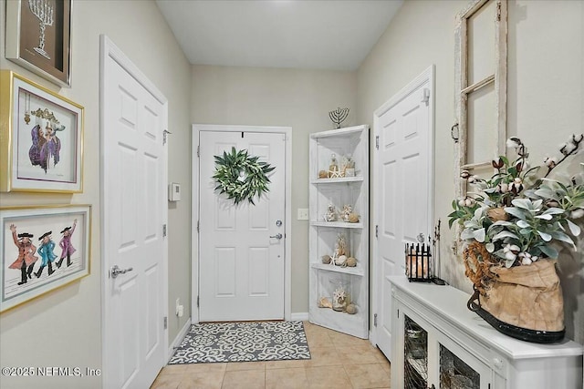 mudroom with light tile patterned floors