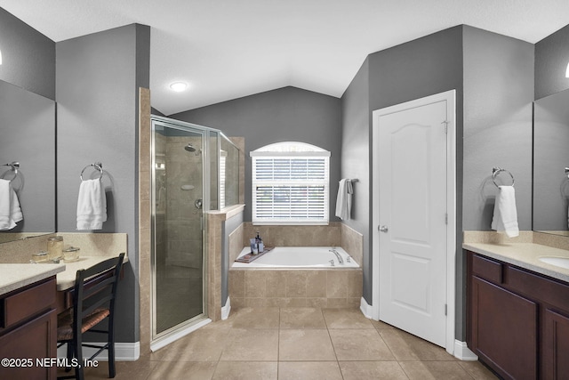 bathroom with tile patterned floors, vanity, lofted ceiling, and plus walk in shower