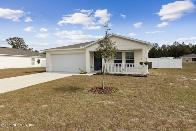 view of front of house featuring a garage, a front yard, and a porch