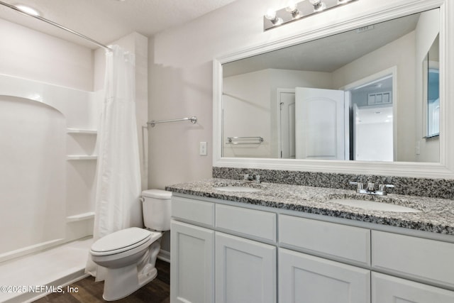 195 River Rdg Pl, Welaka, FL 32193 - bathroom featuring vanity, hardwood / wood-style floors, curtained shower, and toilet