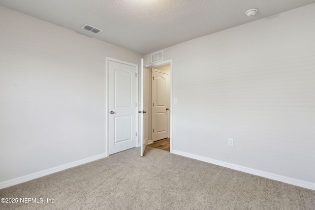 195 River Rdg Pl, Welaka, FL 32193 - spare room with light colored carpet and a textured ceiling