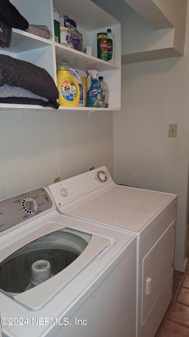 washroom with tile patterned floors and washing machine and clothes dryer