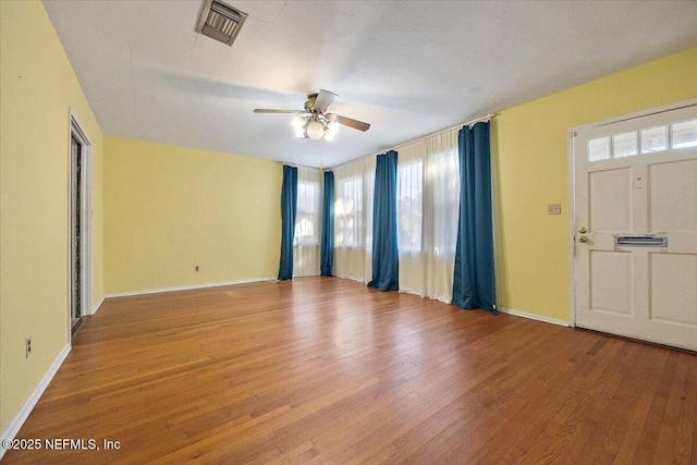 interior space with ceiling fan and wood-type flooring