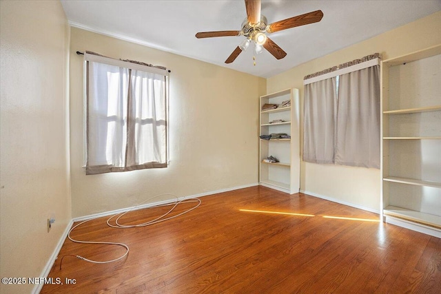 unfurnished bedroom featuring ceiling fan and hardwood / wood-style flooring