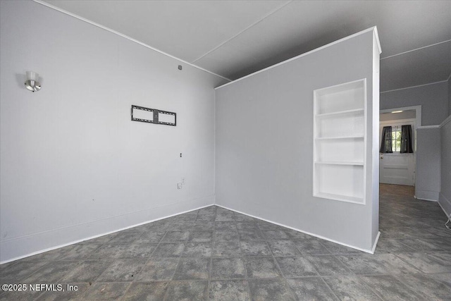 empty room featuring built in shelves