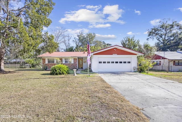 ranch-style house featuring a front lawn and a garage