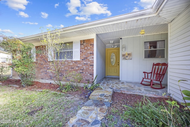 doorway to property featuring covered porch