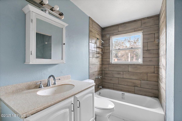 full bathroom with toilet, tiled shower / bath combo, and vanity