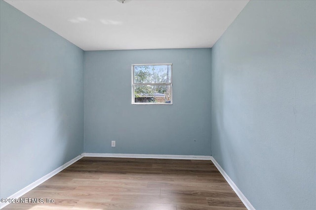 spare room with light hardwood / wood-style floors