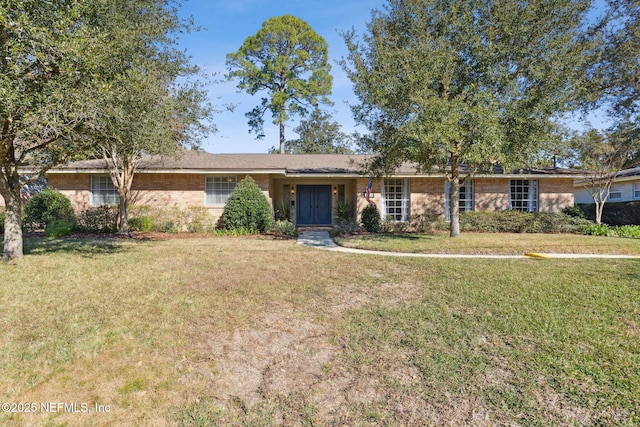 ranch-style home featuring a front yard