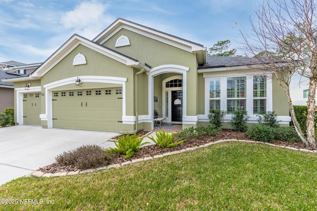 ranch-style home with a garage and a front lawn