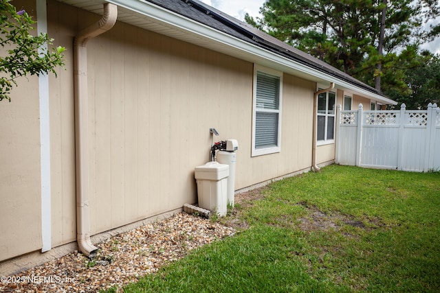 view of side of home featuring a yard