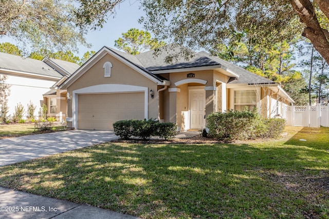 view of front of house with a garage and a front lawn