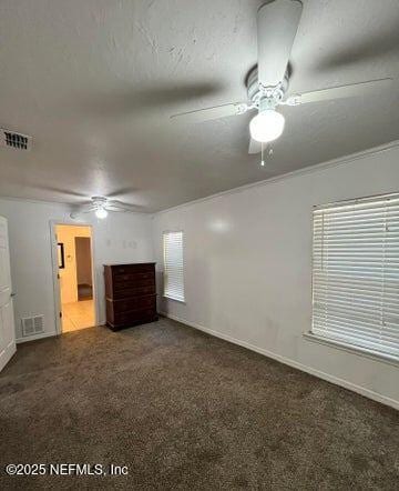 carpeted empty room featuring ornamental molding