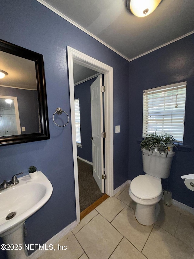 361 Broward St, Jacksonville, FL 32204 - half bath featuring crown molding, toilet, a sink, and baseboards