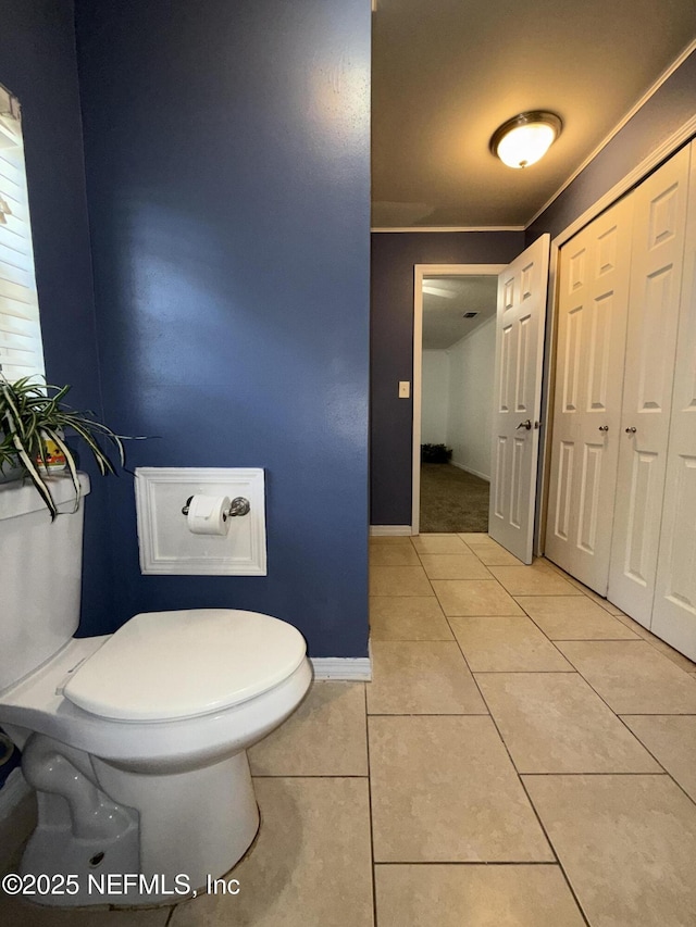 361 Broward St, Jacksonville, FL 32204 - bathroom with toilet, tile patterned flooring, and baseboards