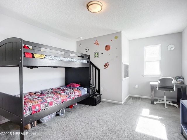 carpeted bedroom with a textured ceiling