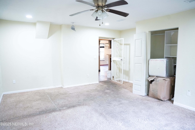 unfurnished bedroom with ceiling fan and light carpet