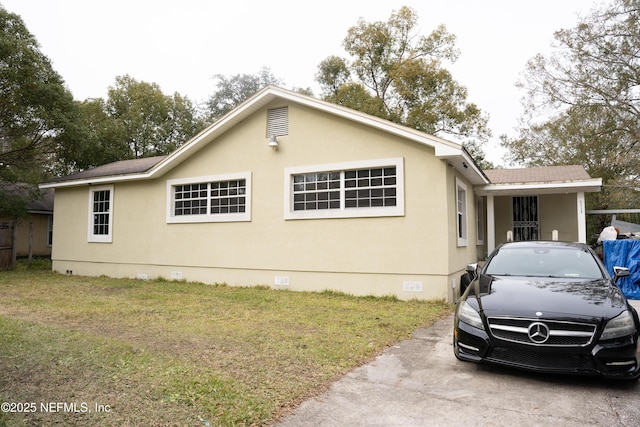 view of property exterior with a yard