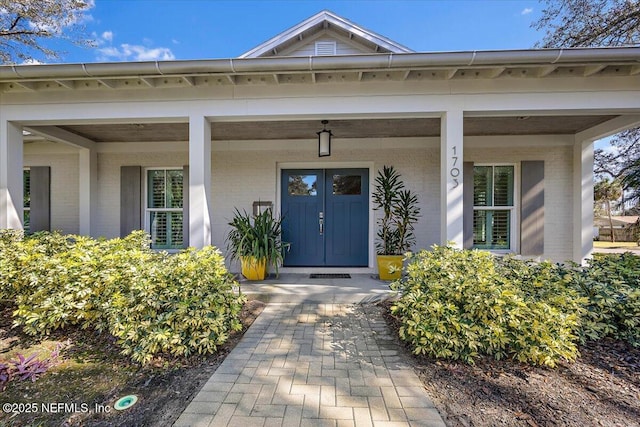 entrance to property featuring a porch