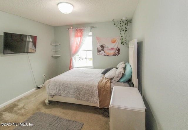 carpeted bedroom featuring a textured ceiling