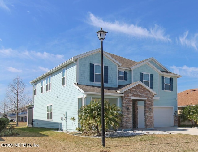 view of front of property with a garage and a front yard