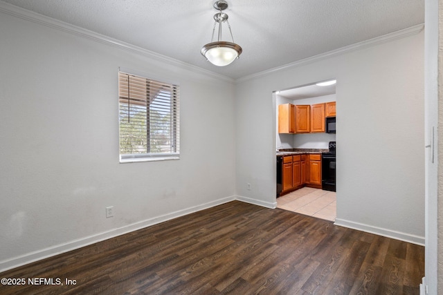 unfurnished dining area with a textured ceiling, crown molding, and light wood-type flooring