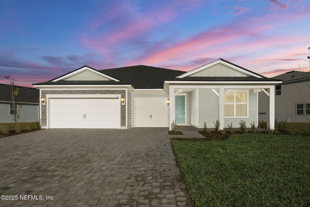 133 Beechnut Cir, Saint Augustine, FL 32095 - view of front of house featuring a garage and a yard
